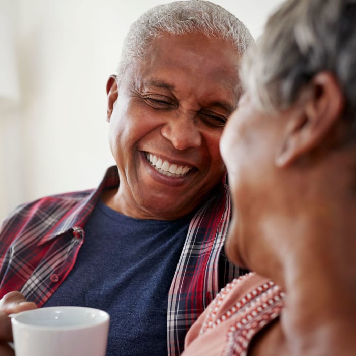 A resident couple smile at each other Acclaim at Cary Pointe, Cary, North Carolina