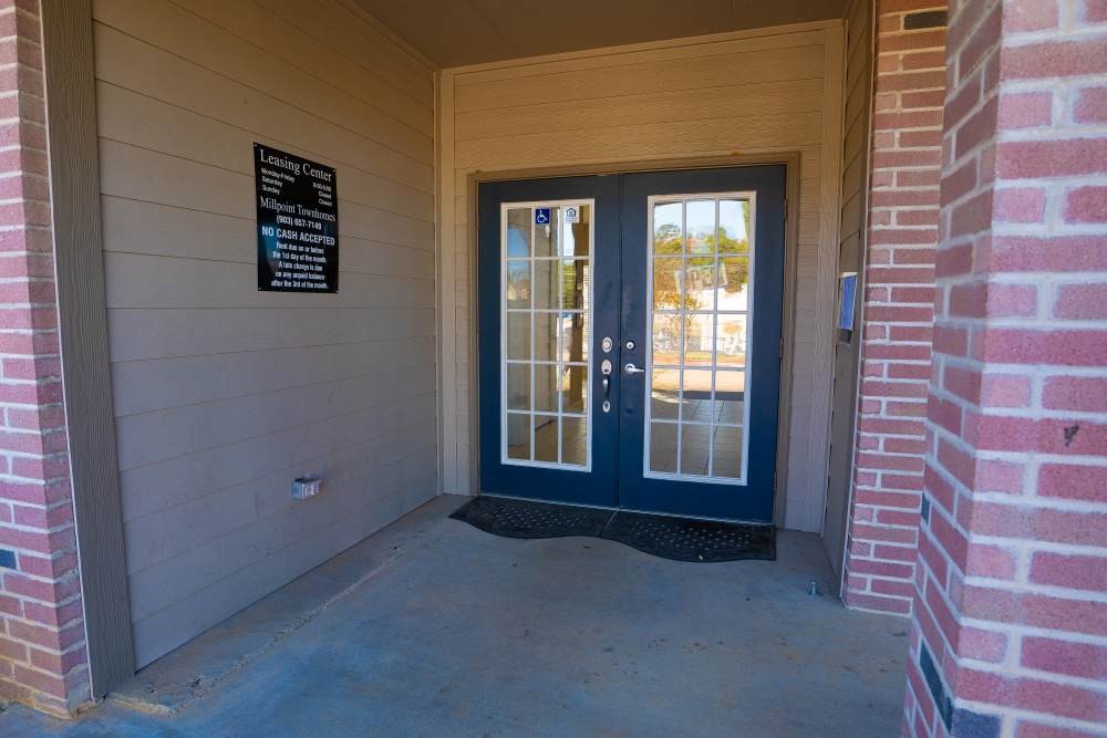 Community clubhouse entrance at Millpoint Townhomes in Henderson, Texas