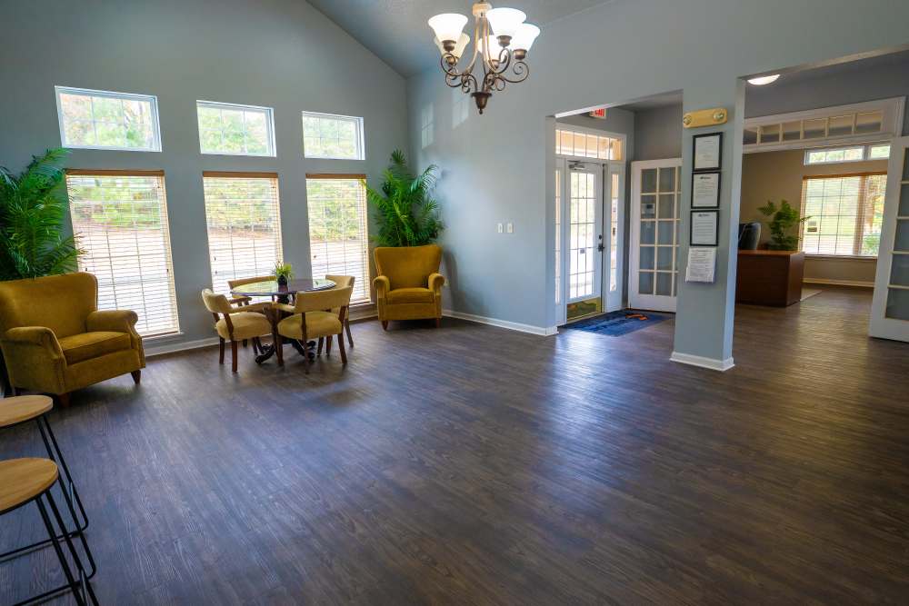 Community clubhouse with seating area at Jacksonville Pines in Jacksonville, Texas
