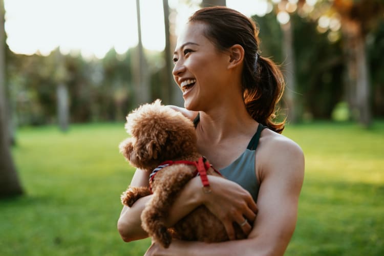 Resident and her dog enjoying their new life at Lumen Apartments in Everett, Washington
