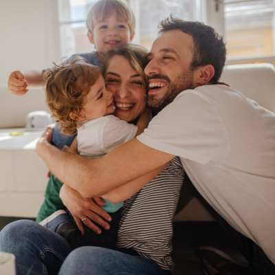 Happy family in the apartment at The Ideal in Madison, Wisconsin