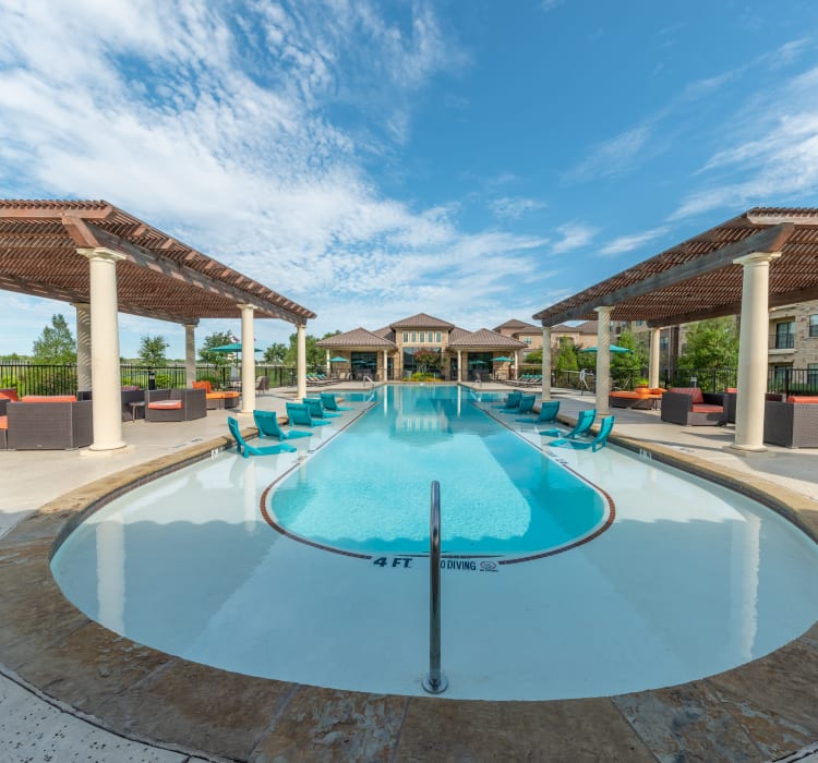 Bueatiful pool and cabanas at Evolv in Mansfield, Texas