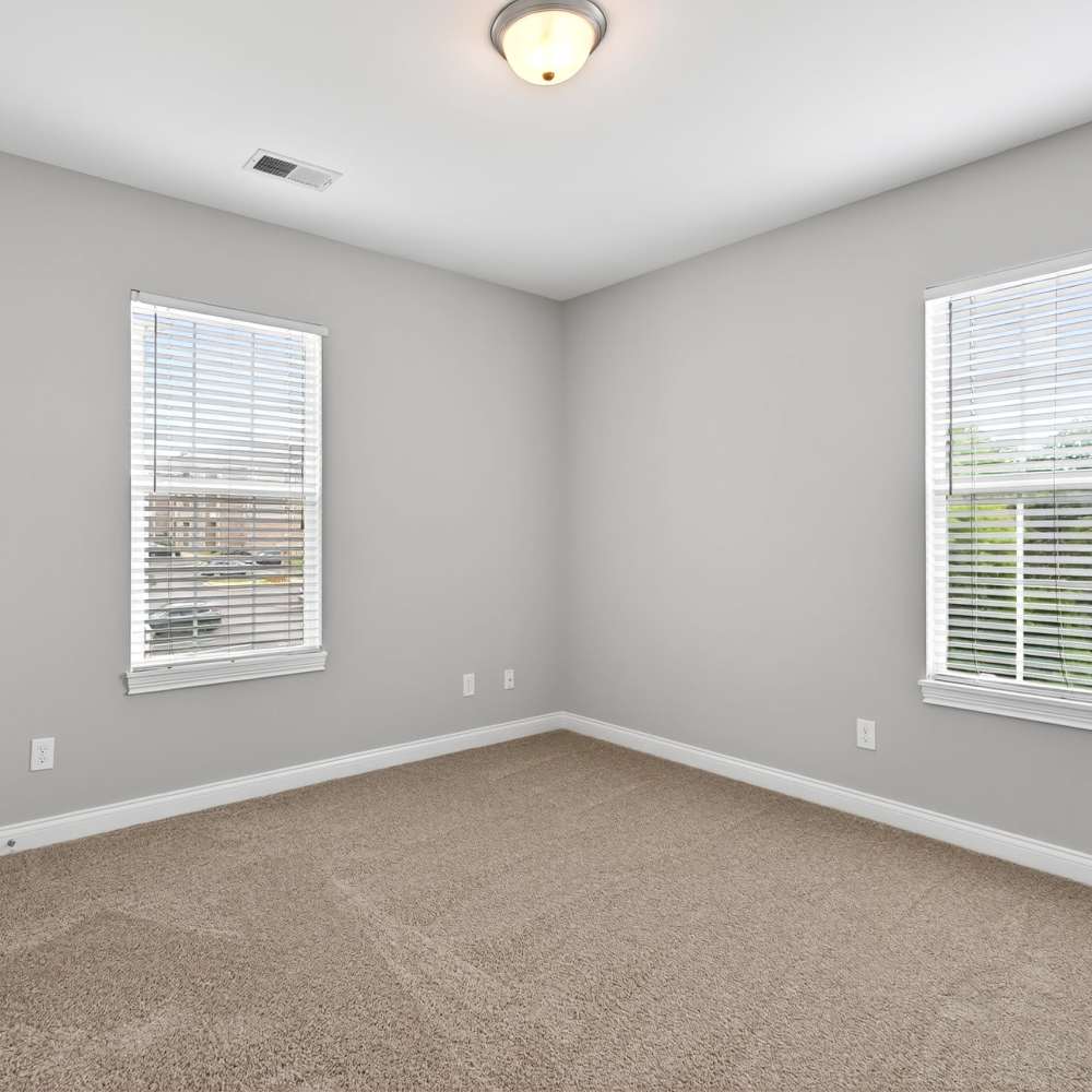 Unfurnished bedroom with large windows at Palomar View Apartments in Lexington, Kentucky