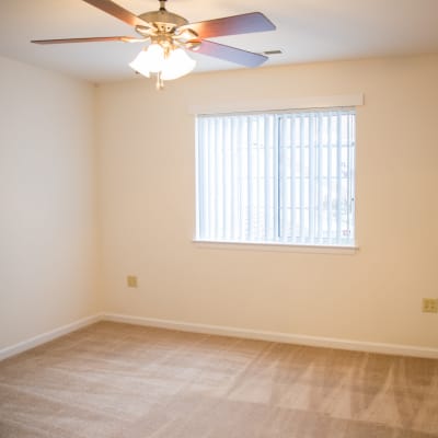 A well-lit bedroom at Dahlgren Townhomes in Dahlgren, Virginia