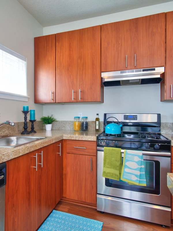 Kitchen with stainless-steel appliances at Sunset Crossing in Beaverton, Oregon
