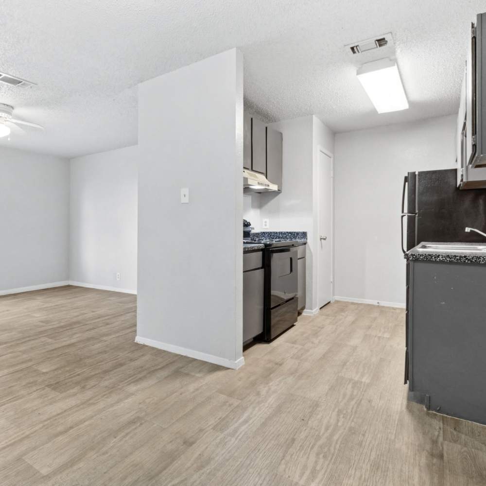 Wood-style flooring in the apartment at Arbors of Taylor in Taylor, Texas