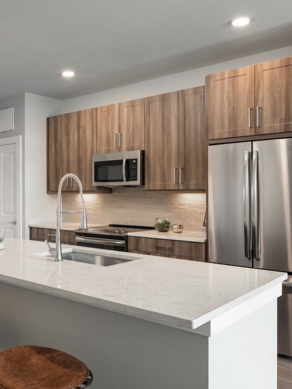 Sleek, modern kitchen at Bellrock Market Station in Katy, Texas