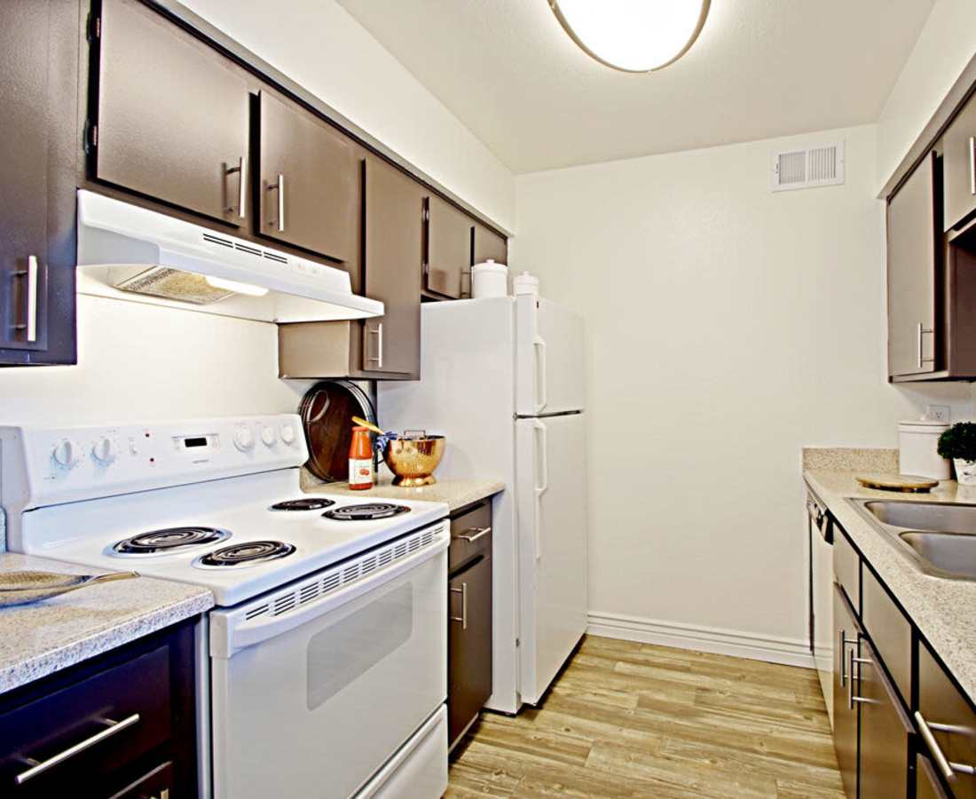 Apartment kitchen with stainless-steel appliances at 544 Southern Apartments in Mesa, Arizona