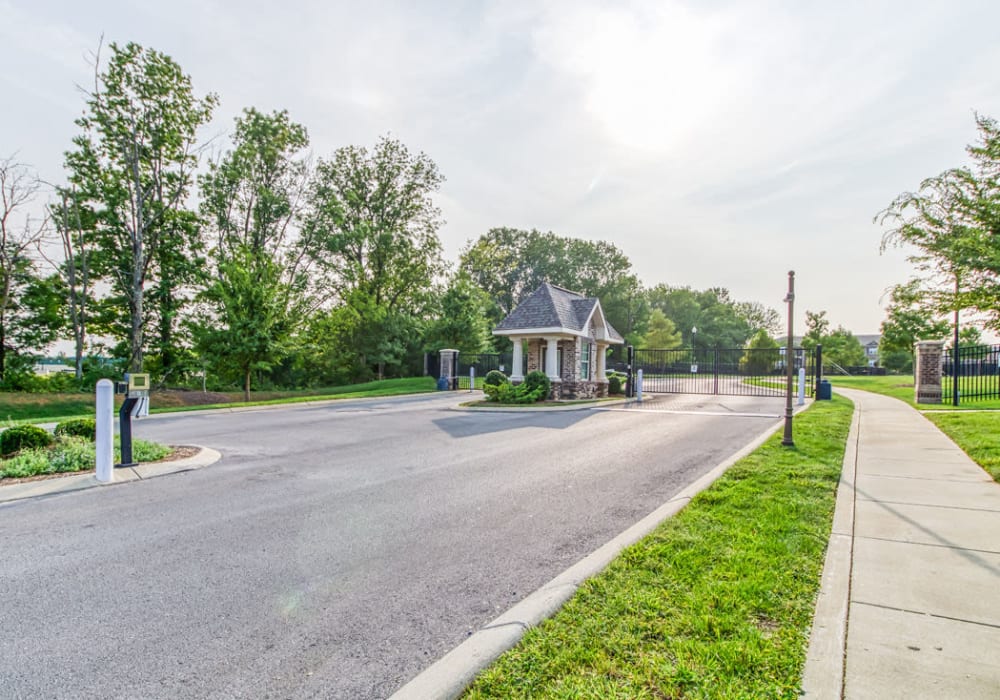 Gated community with plenty of areas to walk in nature including green grass and trees at Everwood at The Avenue in Murfreesboro, Tennessee