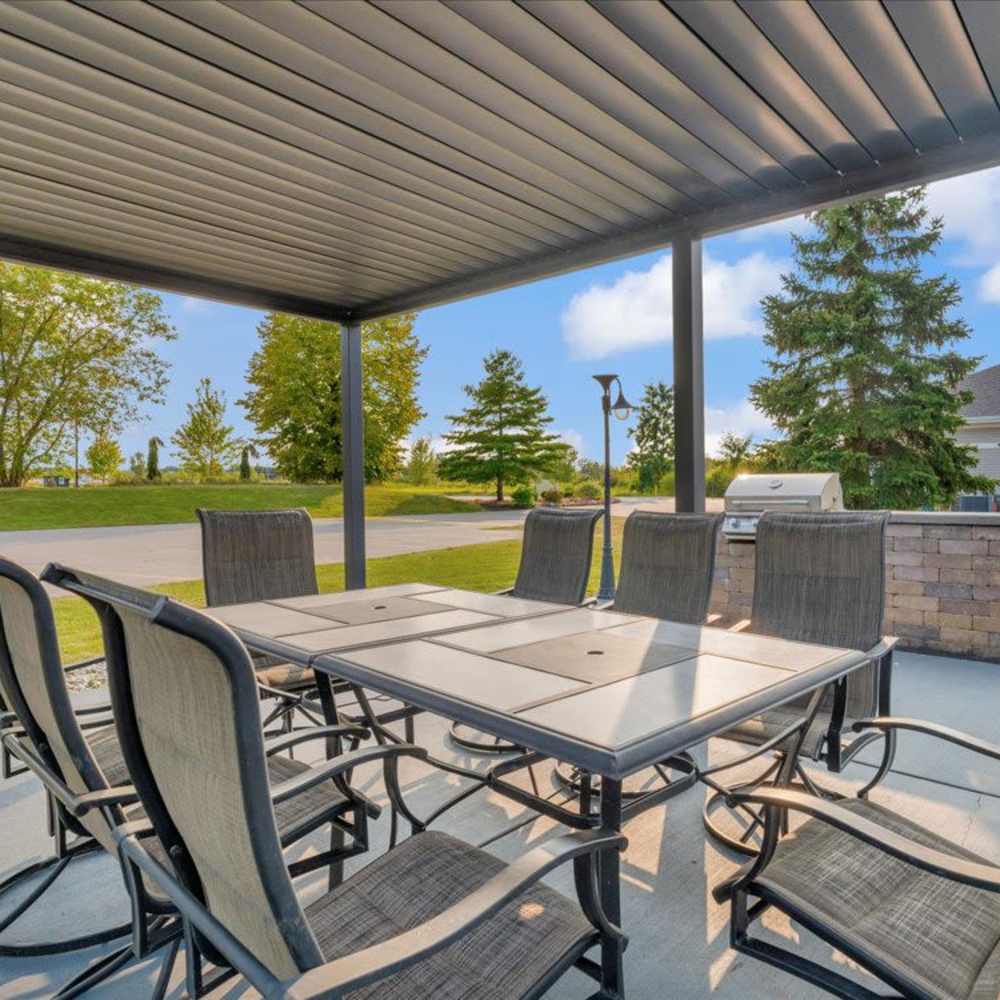 Covered patio dining area at River Club in Holland, Michigan