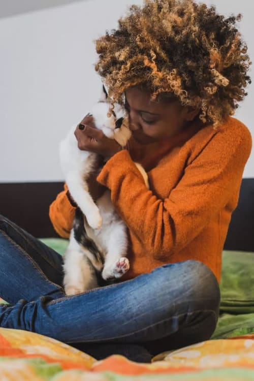 Resident cuddling with her kitten at Parallel 36 at Jailette in Atlanta, Georgia