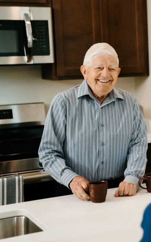 Guy in kitchen at The Pillars of Hermantown in Hermantown, Minnesota