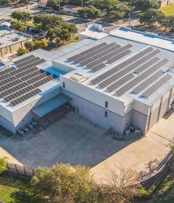 A couple carrying boxes at Storage Hub - Huebner in San Antonio, Texas