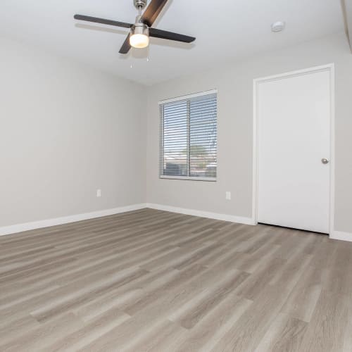 Apartment with ceiling fan and wood-style flooring at Tides at North Nellis in Las Vegas, Nevada