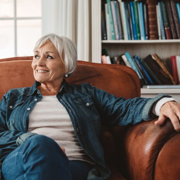 Woman sitting in a chair at The Crest at Citrus Heights in Citrus Heights, California
