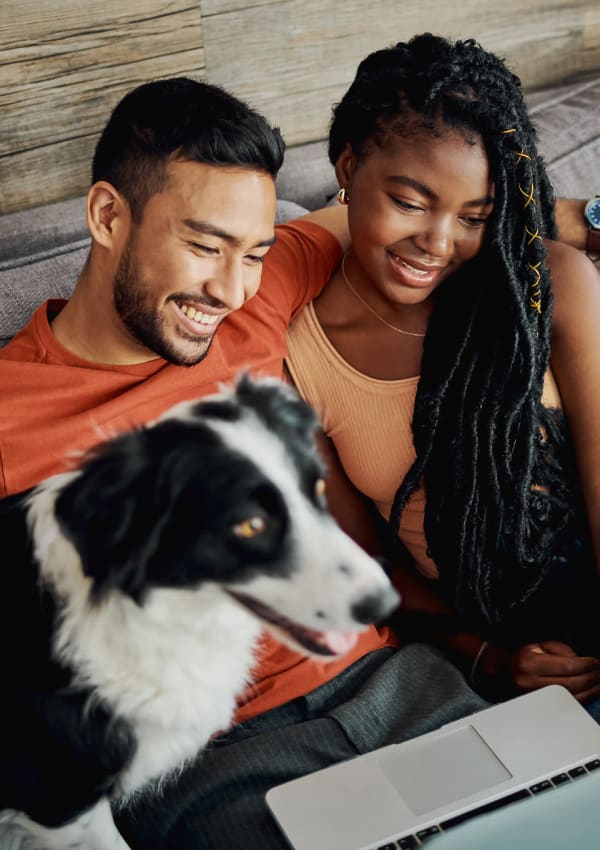 Residents sit with their puppy at The Linq, Chandler, Arizona