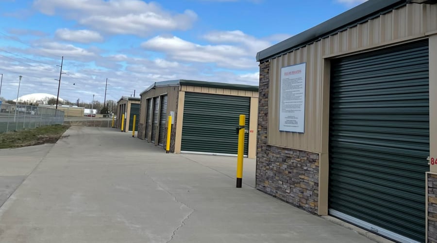 Storage units with green doors and locks at KO Storage in Vermillion, South Dakota