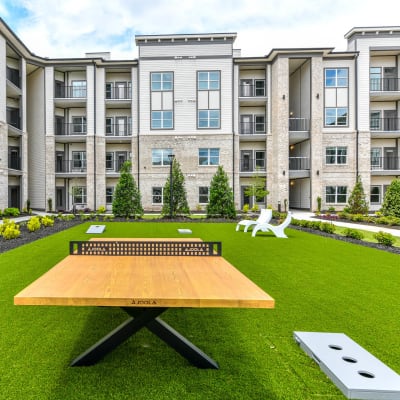 Cornhole and ping pong table in the courtyard at Somerset in McDonough, Georgia