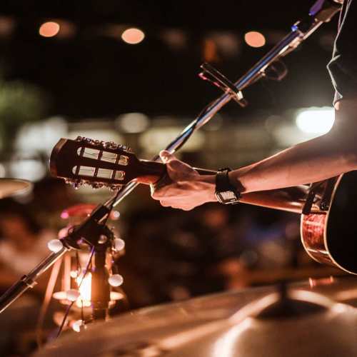 Man playing guitar near The Marling in Madison, Wisconsin