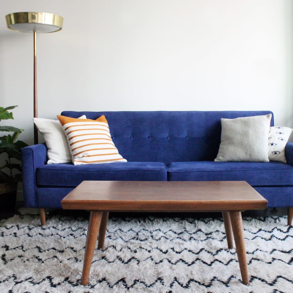 Modern furnishings in the living area of a model home at Sofi Belmont Hills in Belmont, California