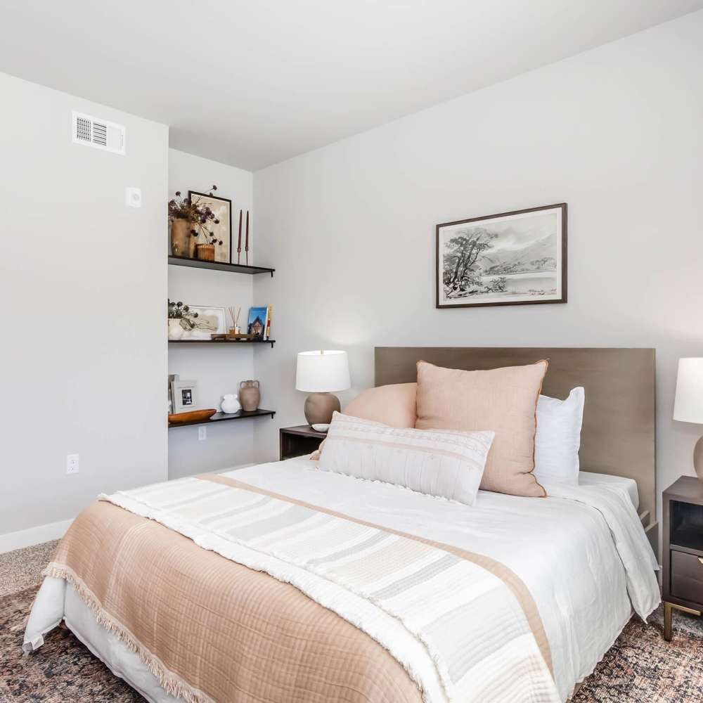 Comfortable bedroom with large bedroom and carpet flooring at InterUrban 2.0 in Billings, Montana