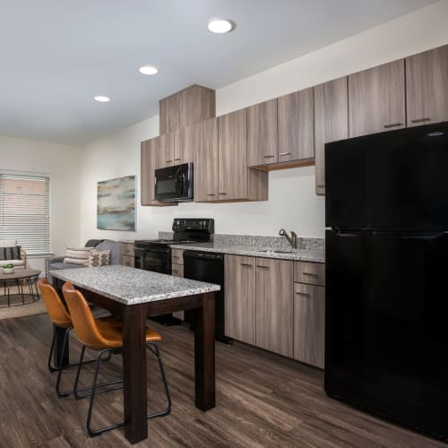 Kitchen with bar stools at The Concord Northside in Richmond, Virginia