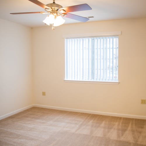 A cozy bedroom at Dahlgren Townhomes in Dahlgren, Virginia