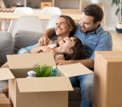 A family packing with boxes from Extra Attic Mini Storage - Patterson in Richmond, Virginia