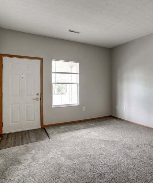Living area of apartment with entrance at Ridgewood Greene in Reynoldsville, Pennsylvania