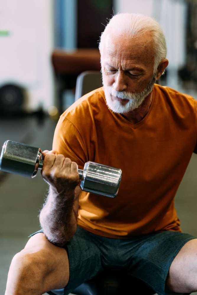 Resident exercising in the fitness center at Heirloom at Torrey Pines in Las Vegas, Nevada