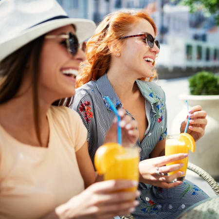 Residents enjoying a tropical cocktail on a sunny day at Biltmore at the Park in Pflugerville, Texas