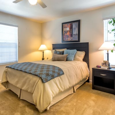 A well-lit bedroom at The Village at Serra Mesa in San Diego, California