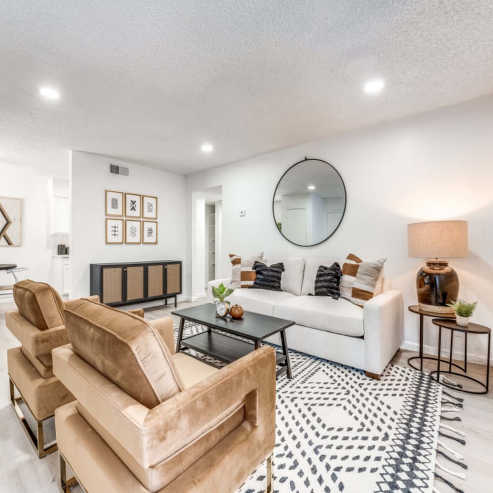 Modern living room with large windows at Merida in San Antonio, Texas