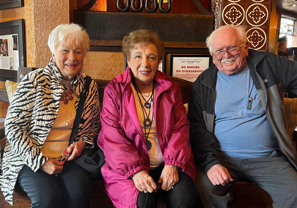 Resident friends posing together at Merrill Gardens at Tacoma in Tacoma, Washington
