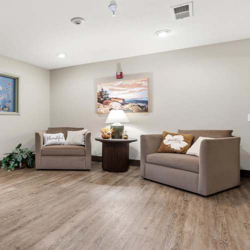 Beautiful community lounge area with chairs at Norwood Greene Senior Living in Marietta, Ohio