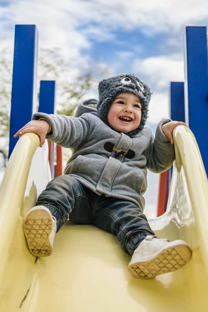 Kid playing on slide at Filbin Creek in North Charleston, South Carolina