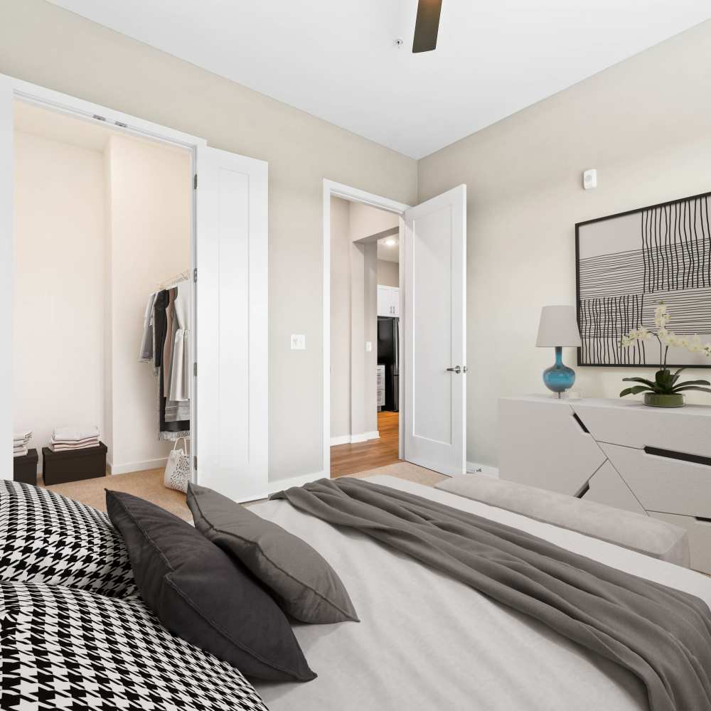 Bedroom with ceiling fan and walk-in closet at Neo Vantage Point in Maryland Heights, Missouri
