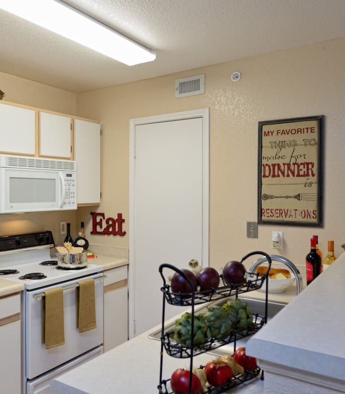 Kitchen with wine rack at Acacia Park Apartments in El Paso, Texas