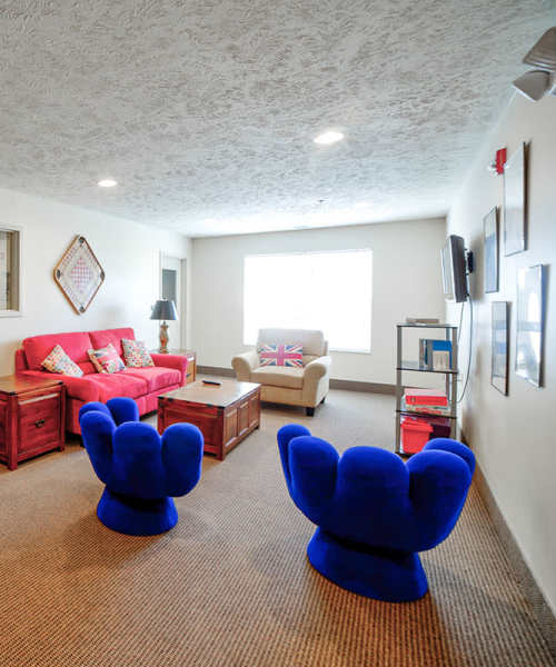Sitting area with plush blue chairs at Cumberland Meadows in Cumberland, Maryland