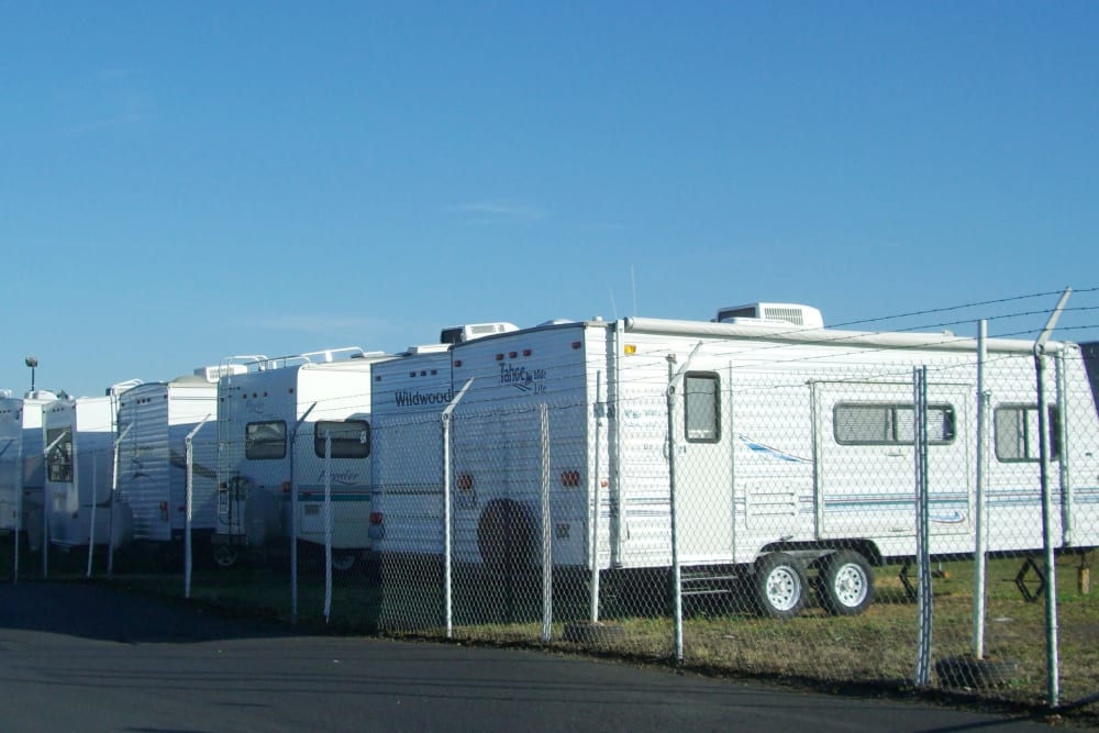 RVs parked behind a gate at U-Lock-It Self Storage in Vancouver, Washington