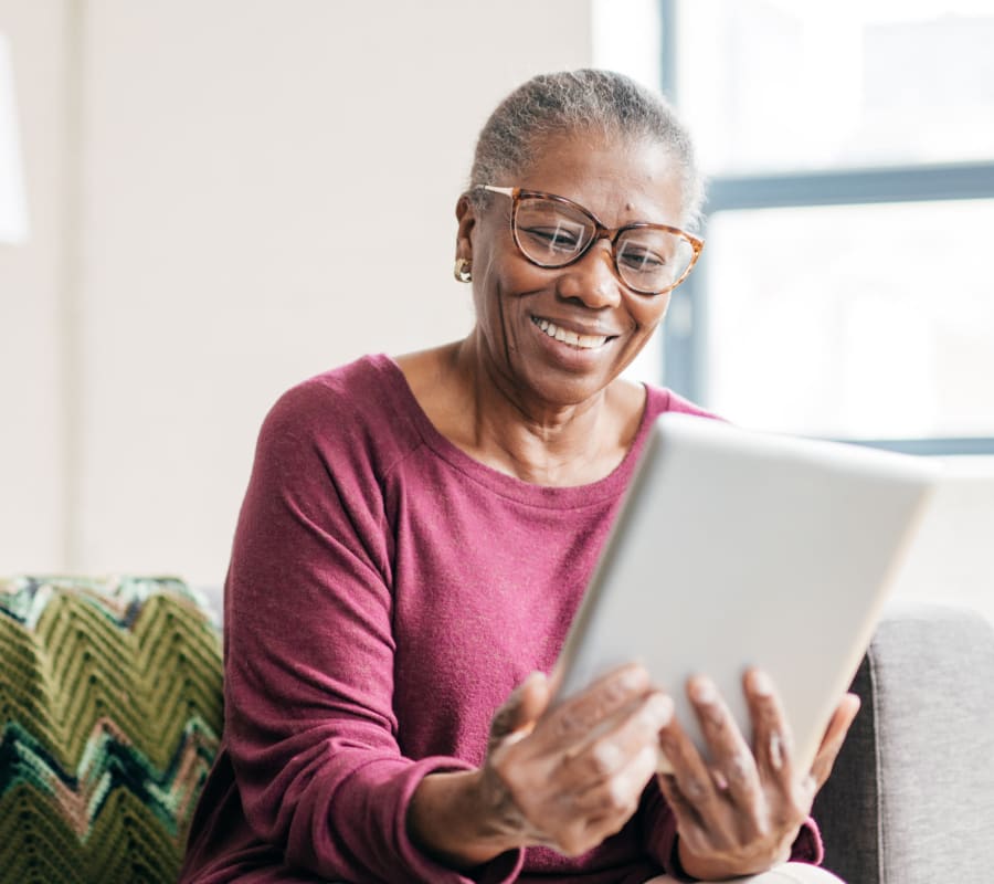 Senior woman looking at tablet at Bozeman Lodge in Bozeman, Montana