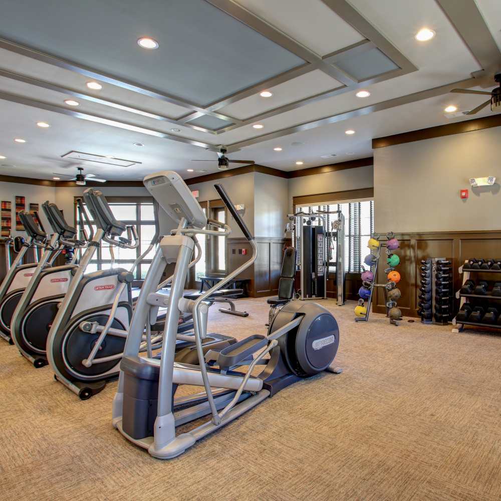 Modern fitness center in a stylish property featuring state-of-the-art equipment and ample natural light at Avonlea Square in Smyrna, Georgia.