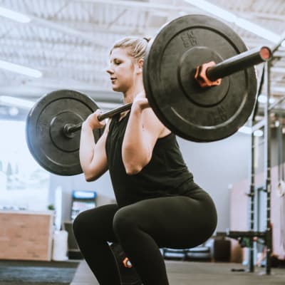 Woman lifting weights at Pacific View in Oceanside, California