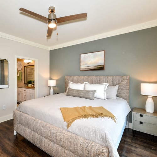 Master bedroom with attached bathroom in a model apartment at Somerset in McDonough, Georgia