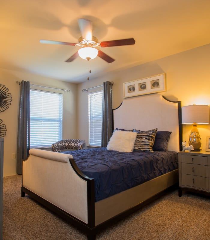 Chic bedroom with ceiling fan at Icon at Broken Arrow in Broken Arrow, Oklahoma