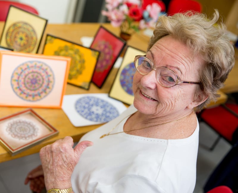 Resident making art at Meadows on Fairview in Wyoming, Minnesota