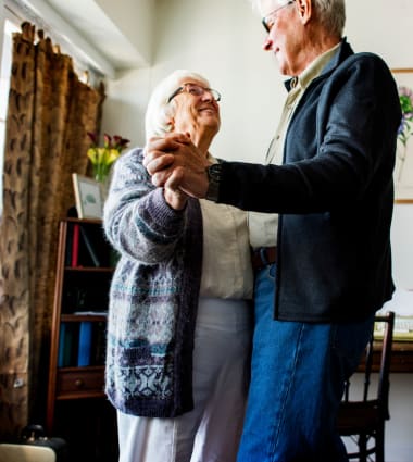 Two residents dancing at Mirror Lake Village Senior Living Community in Federal Way, Washington.