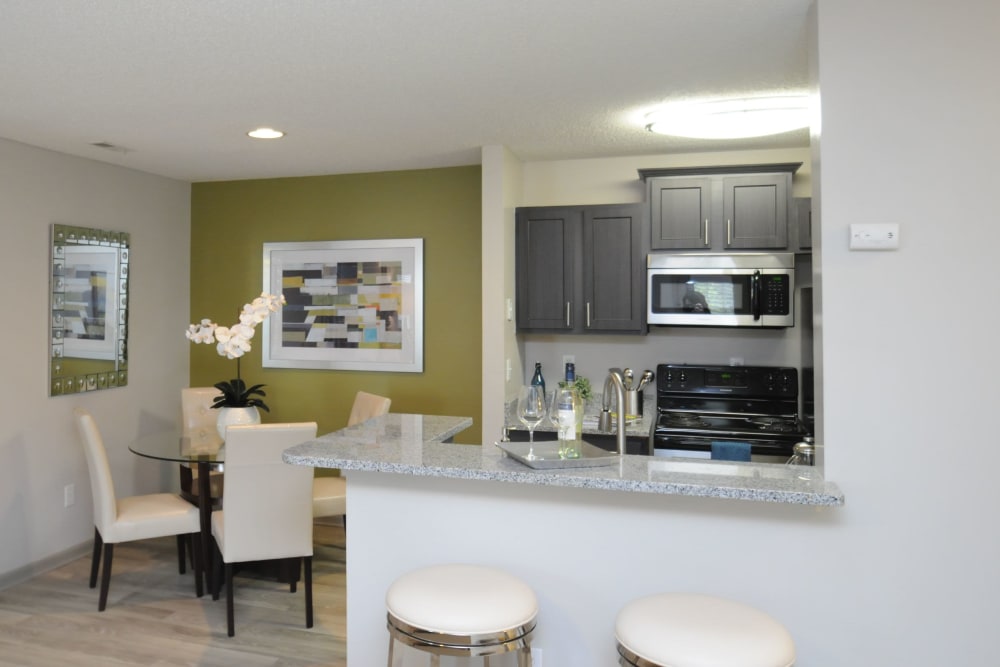 Dining room area and kitchen bar at Goldelm at The Views in Asheville, North Carolina