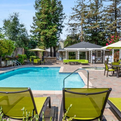 Outdoor swimming pool and spa at Quail Hill Apartments in Castro Valley, California