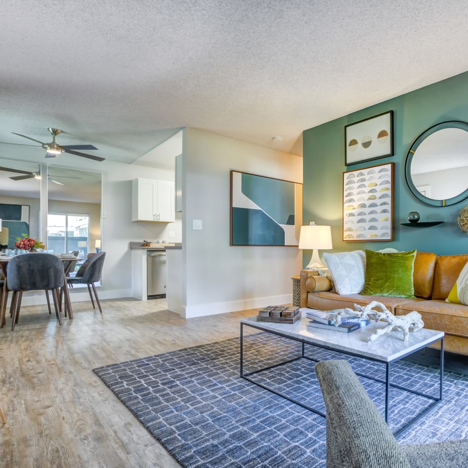 View of the dining area and kitchen from the living space of an open-concept model home at Sofi Union City in Union City, California